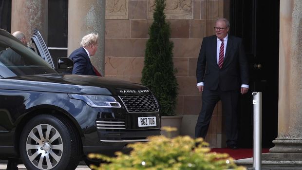 UK prime minister Boris Johnson (centre left) arrives at Hillsborough Castle during a visit to Northern Ireland for talks with Stormont parties. Photograph: Liam McBurney/PA Wire